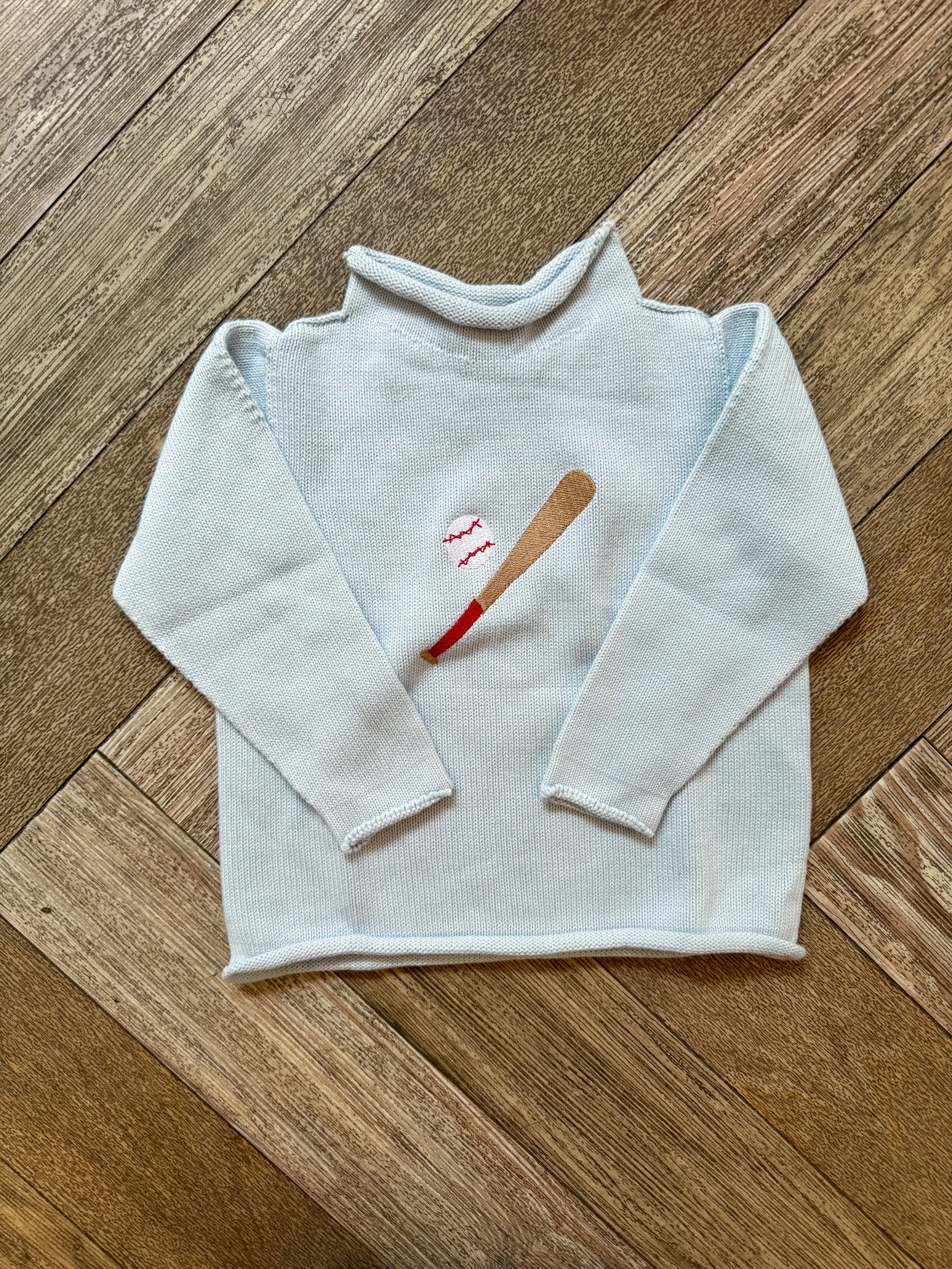 A Soft Idea Roll Neck Sweater in Light Blue with Baseball